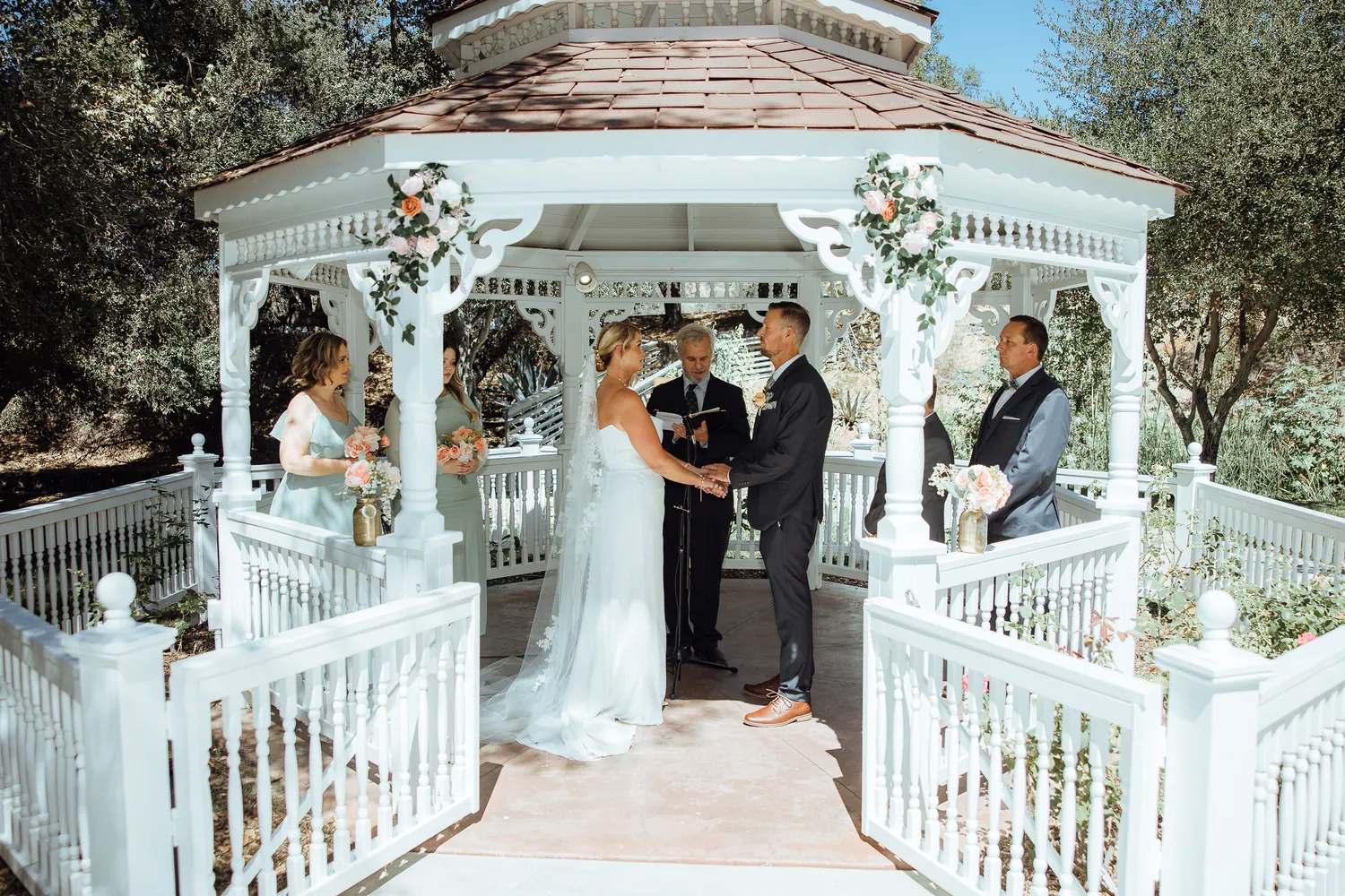 Wedding ceremony in a garden gazebo
